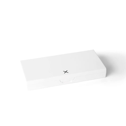 White pill box with hinged lid, closed, small clasp detail