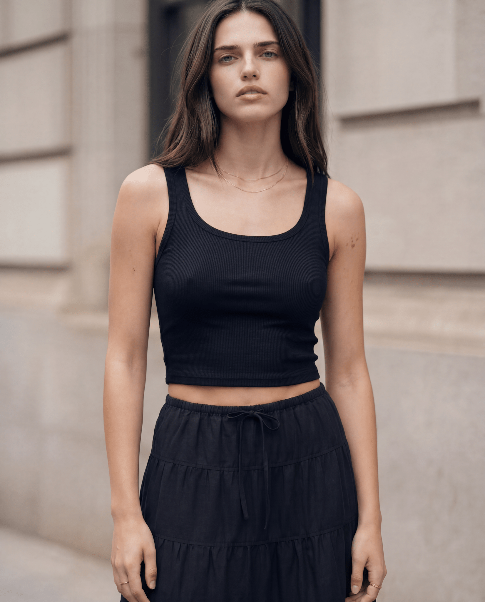Black cropped ribbed tank with scoop neck and sleeveless racerback