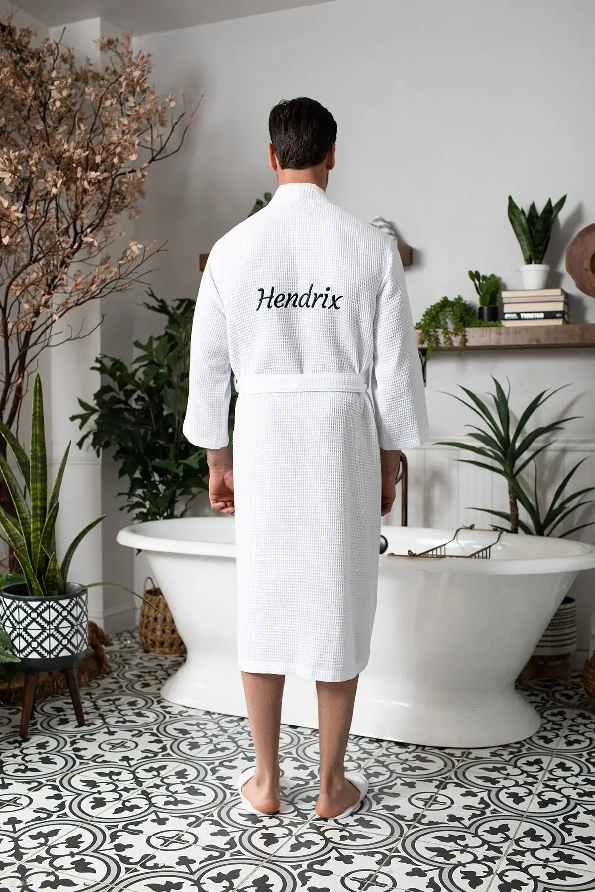 Men's waffle spa bathrobe in white, back view with script embroidery and belted waist.