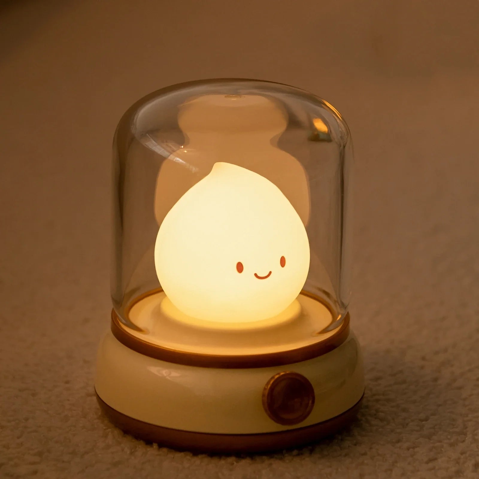 Green flame lantern night light with clear top dome and glowing teardrop flame character.