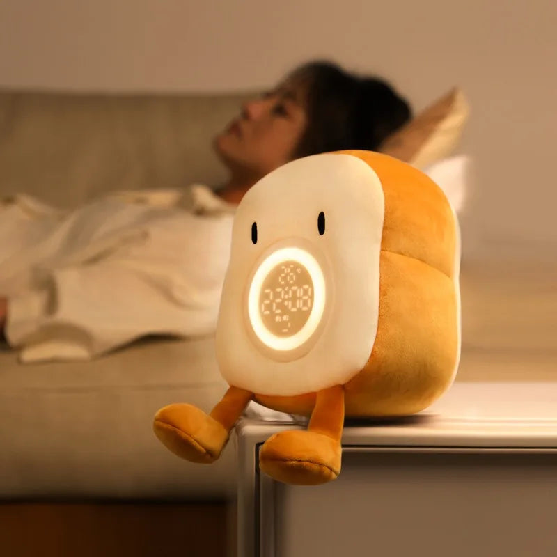 Toast plush alarm clock night light standing with warm LED glow