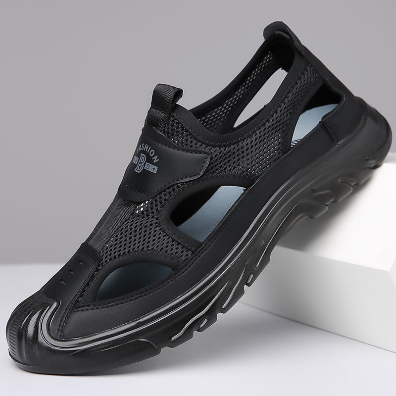 Men's black mesh cutout sandals with padded collar and black cushioned sole