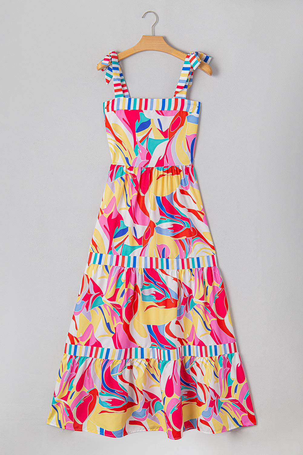 Multicolor tiered maxi sundress on hanger with bow-tie straps and striped-trim tiers