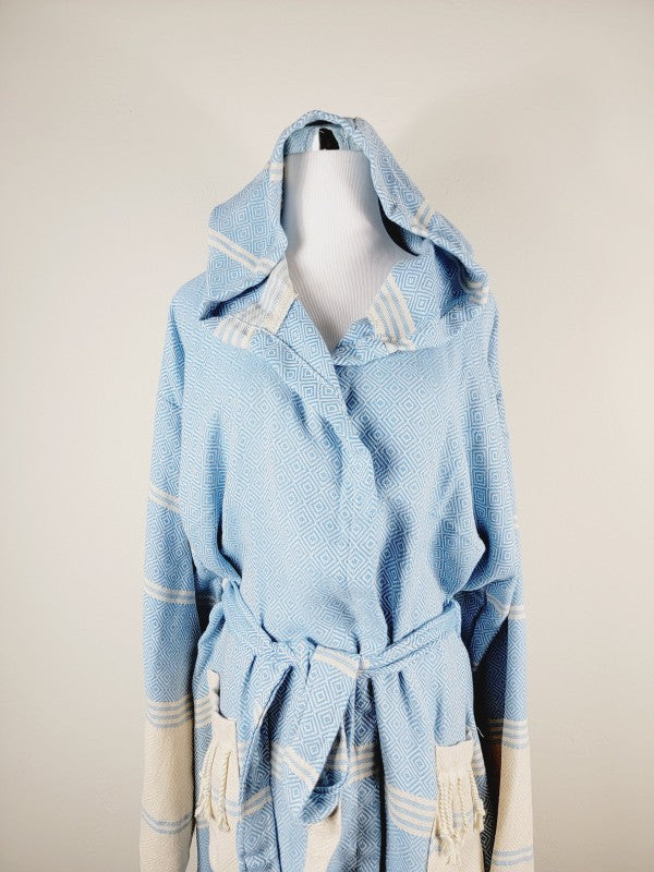 Light blue hooded unisex robe with geometric print, cream trim, tied waist belt