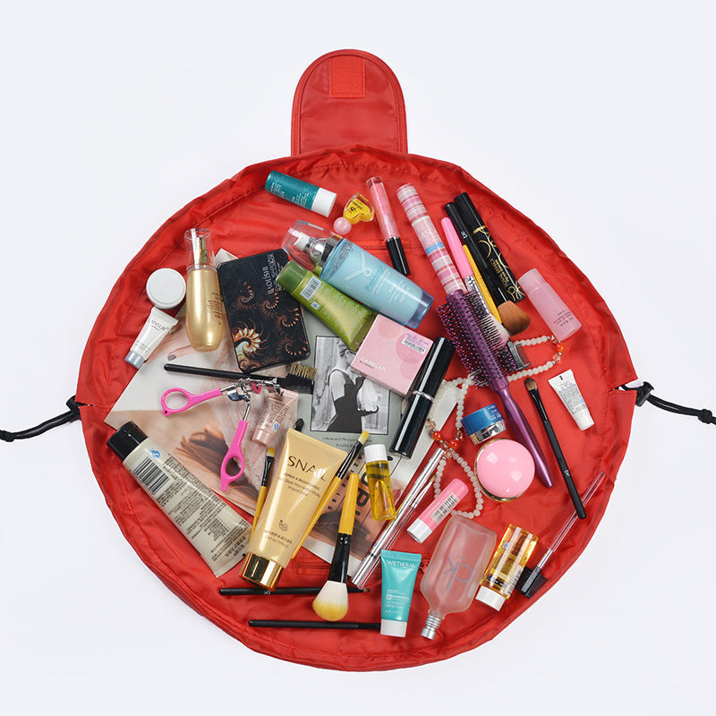 Red waterproof drawstring toiletry bag, open top with toiletries inside