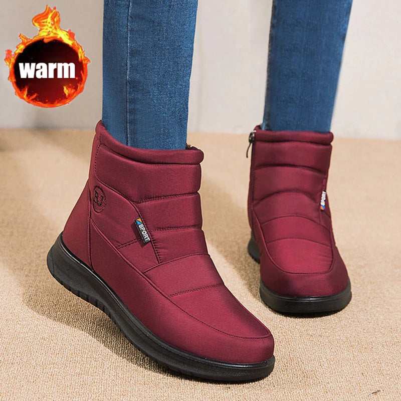 Women’s burgundy ankle boots with padded collar and black rubber sole