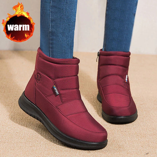 Women’s burgundy ankle boots with padded collar and black rubber sole