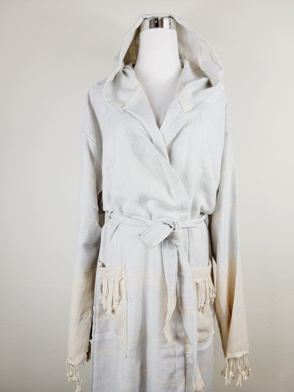 Light white unisex hooded robe with belt tie, two front pockets, and tassel trim