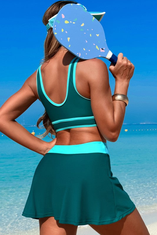 Two-piece high-waisted skirt swimsuit, teal open-back crop top with turquoise trim bands