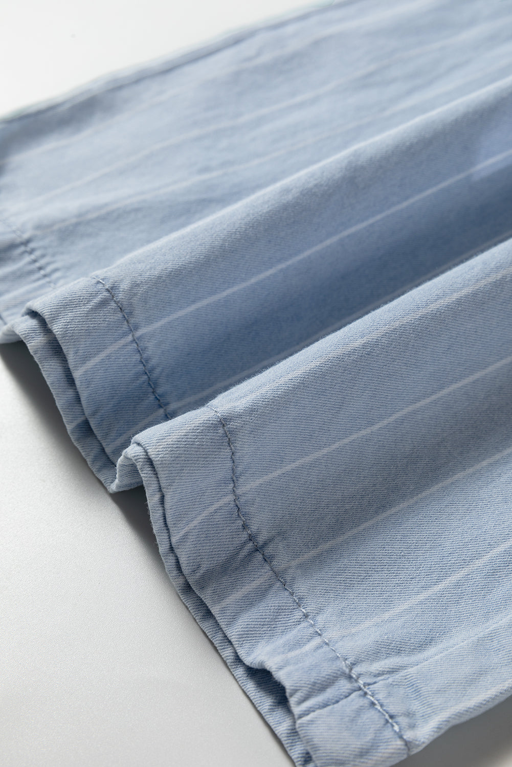 Sky blue stripe trouser hem with stitched cuff detail