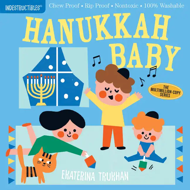 Hanukkah Baby paperback with illustrated children, menorah, and Hanukkah text on blue cover