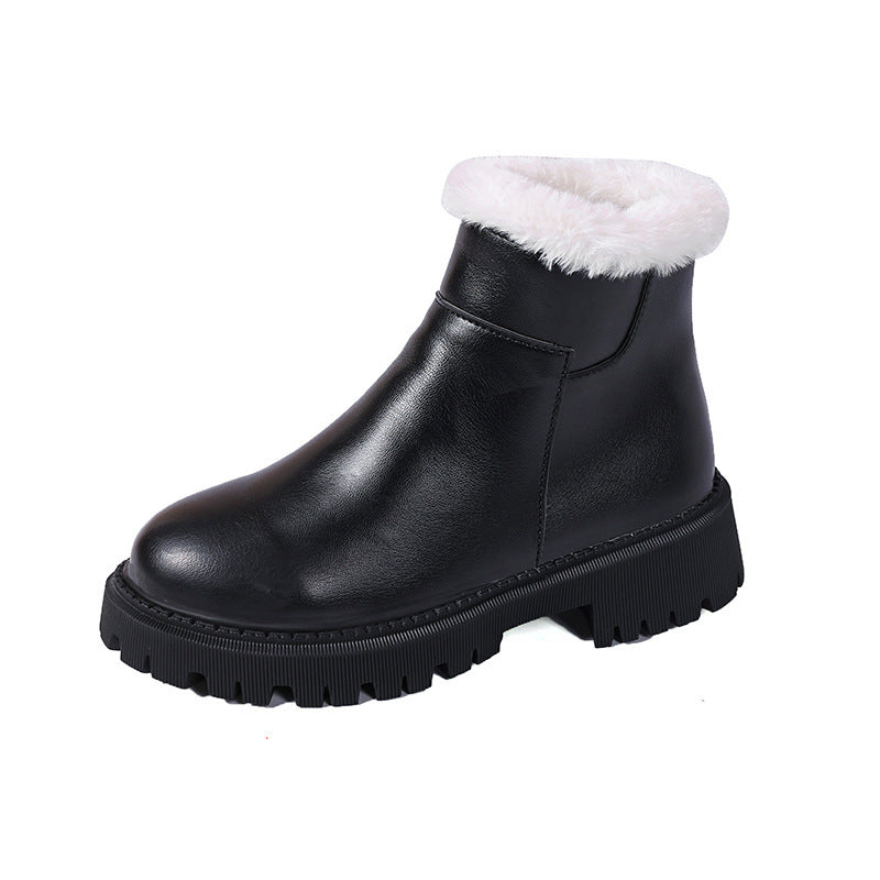 Black leather ankle boot with white faux-fur cuff and chunky lug sole