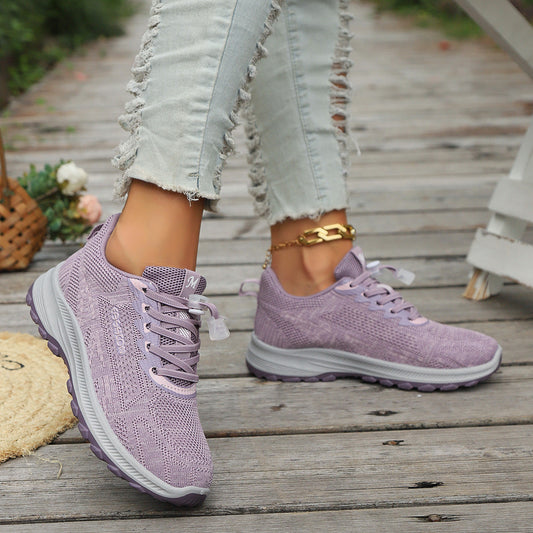 Purple knit lace-up athletic shoes with white sole and cushioned midsole