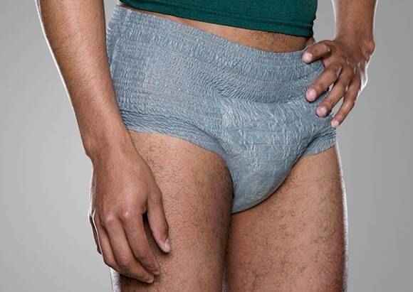 Light blue-gray protective brief underwear, close-up of front panel and stitched seams