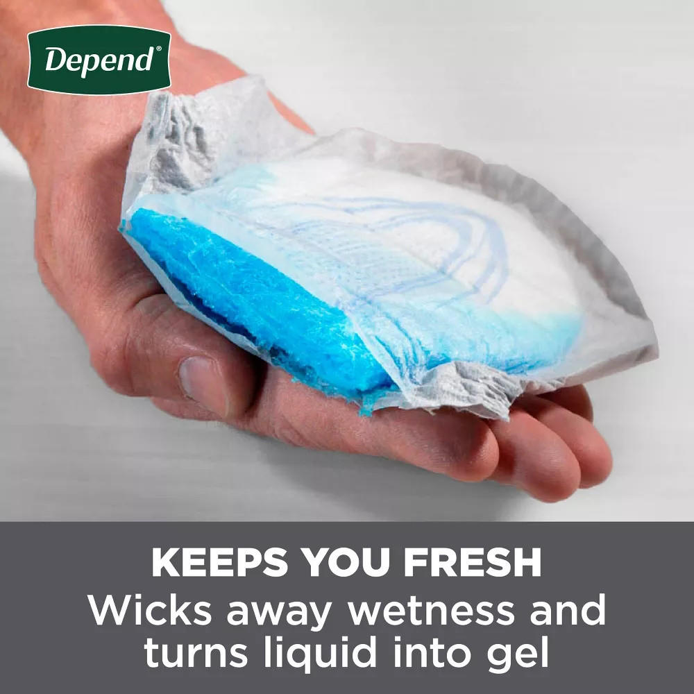 Hands holding a white men’s incontinence guard with a blue gel layer