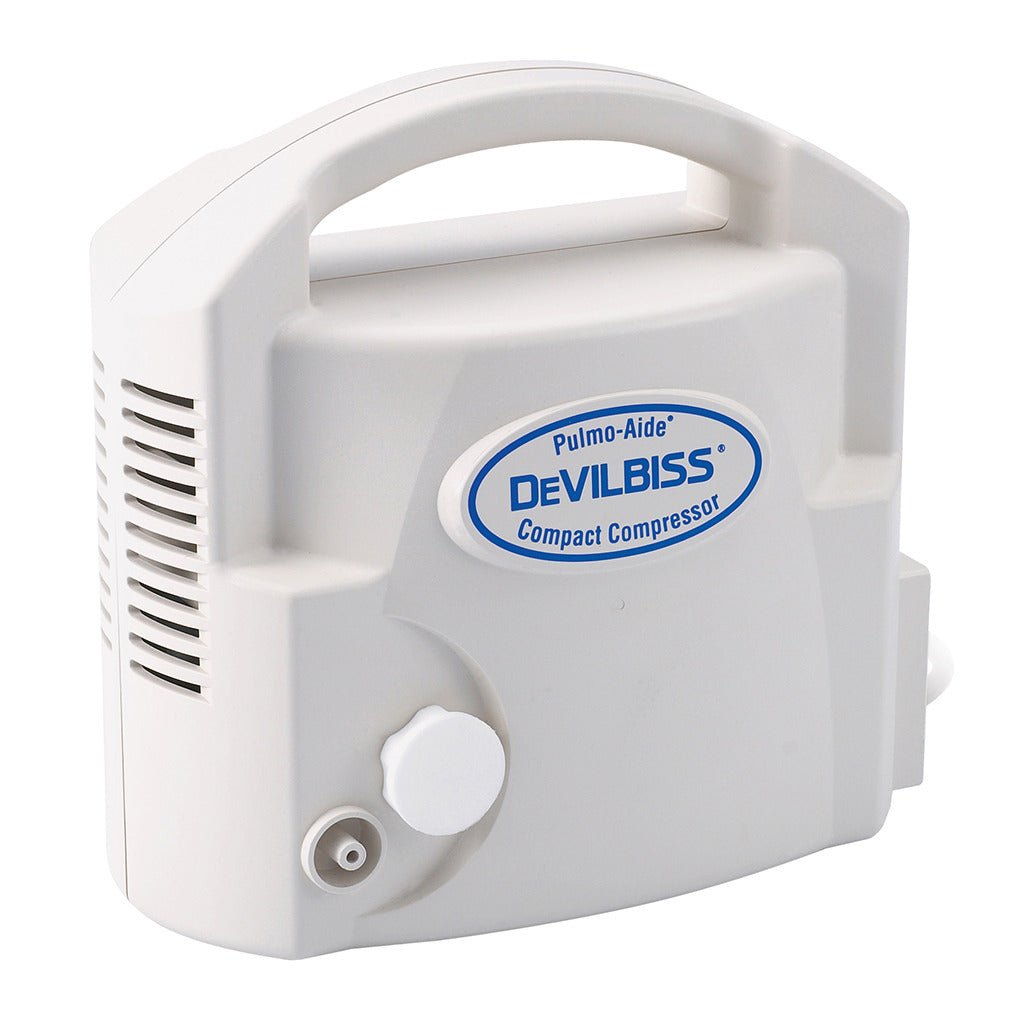 White compact compressor nebulizer device with air intake port and vents