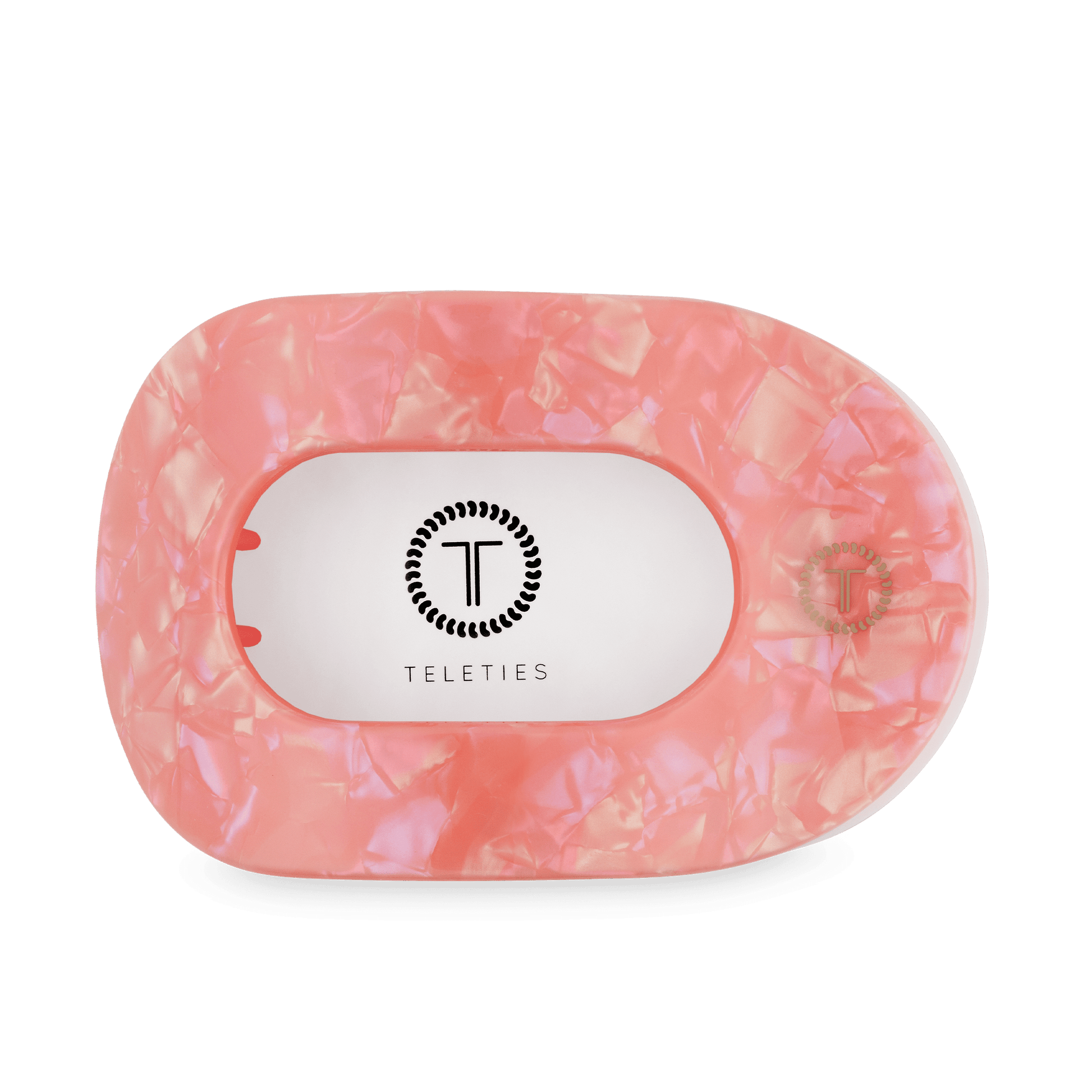 Large flat round hair clip, translucent pink, with Teleties logo on back