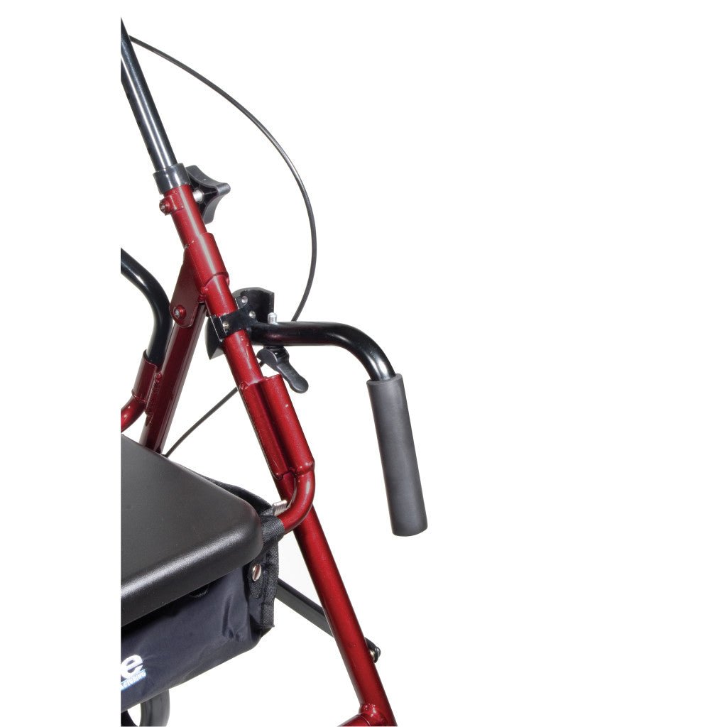 Close-up of red rollator handlebar and arm with black hand grips and cable