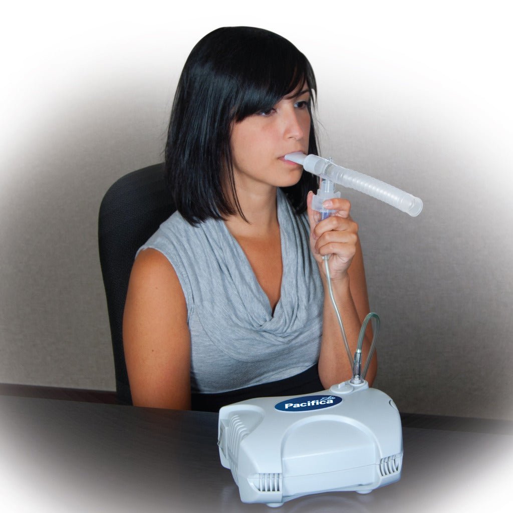 Pacifica Elite nebulizer being used with clear mouthpiece and tubing