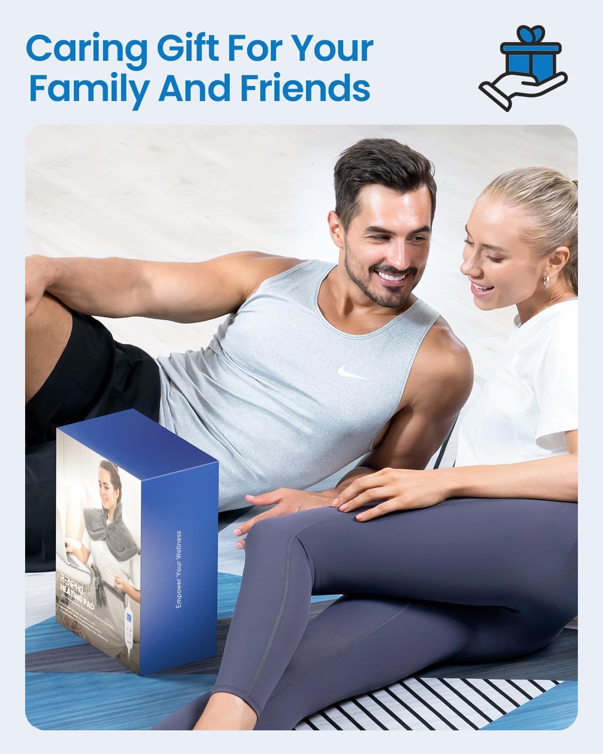 Electric heating pad gift box with cover artwork, shown with two people on a bed
