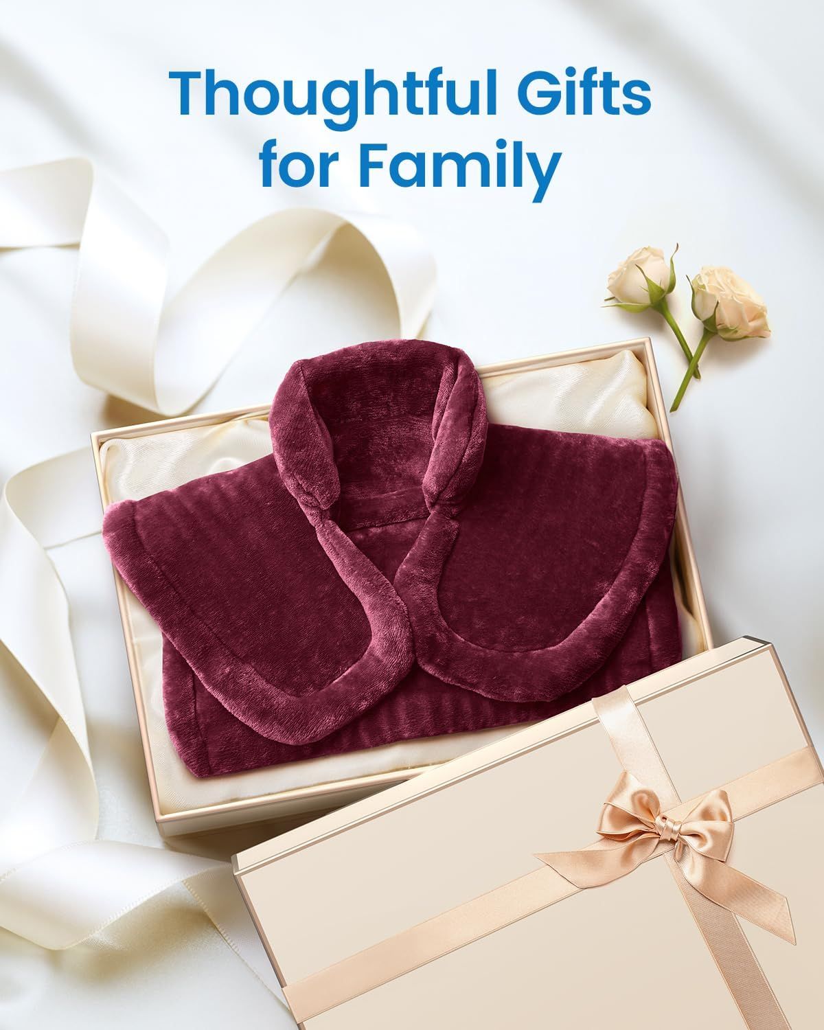 Burgundy plush electric heating pad laid on a gift box with ribbon