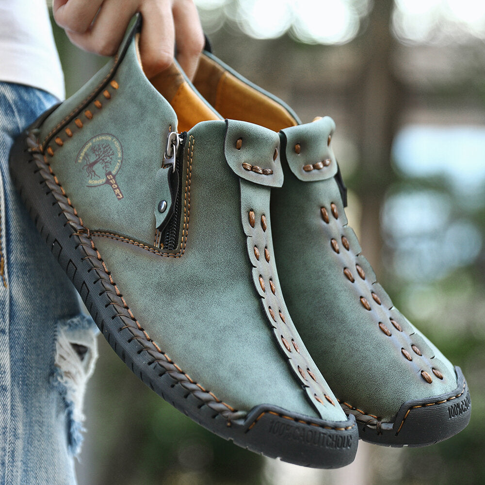 Green men's ankle boots with side zipper, cutout stitch detailing and rubber tread sole