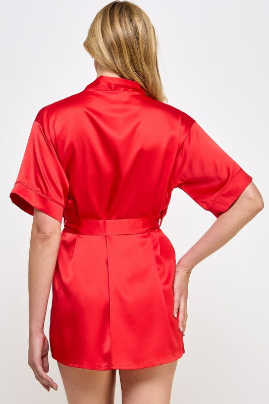 Red satin robe with V-neck, short sleeves, and tied waist belt, back view