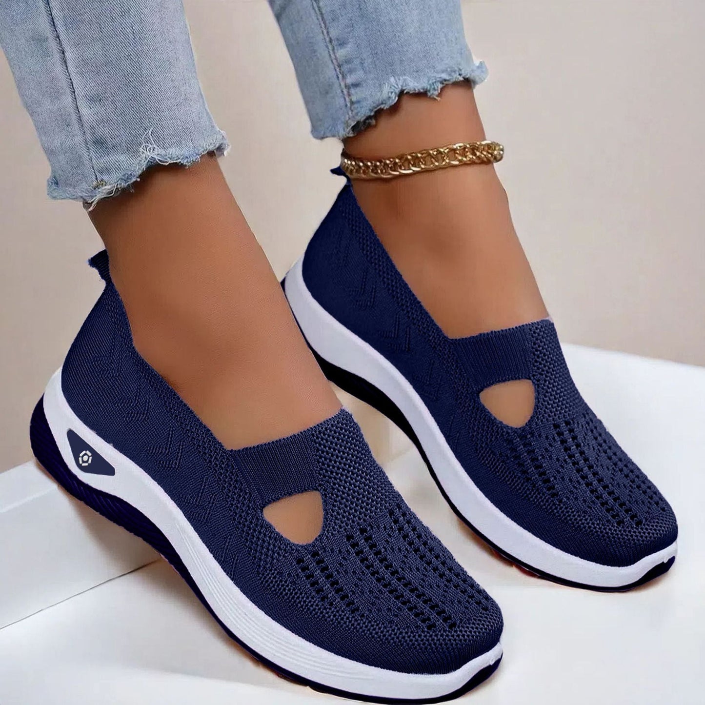 Navy knit mesh flats with oval cutout and white sole, slip-on casual shoes