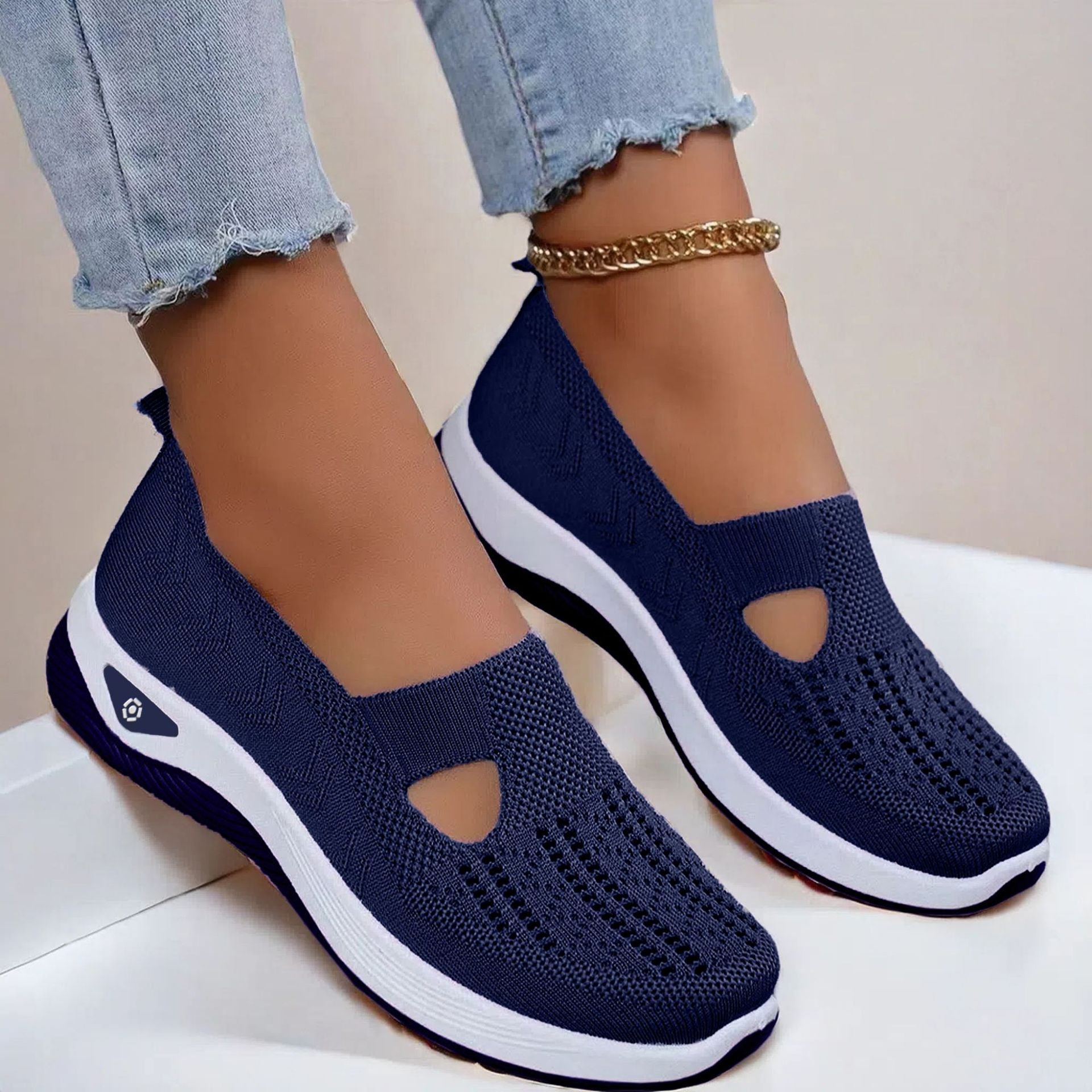 Navy knit mesh flats with oval cutout and white sole, slip-on casual shoes