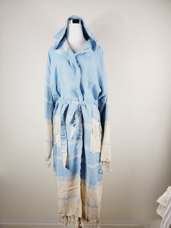 Light blue unisex hooded robe with geometric print, tie belt, cream trim and fringed cuffs