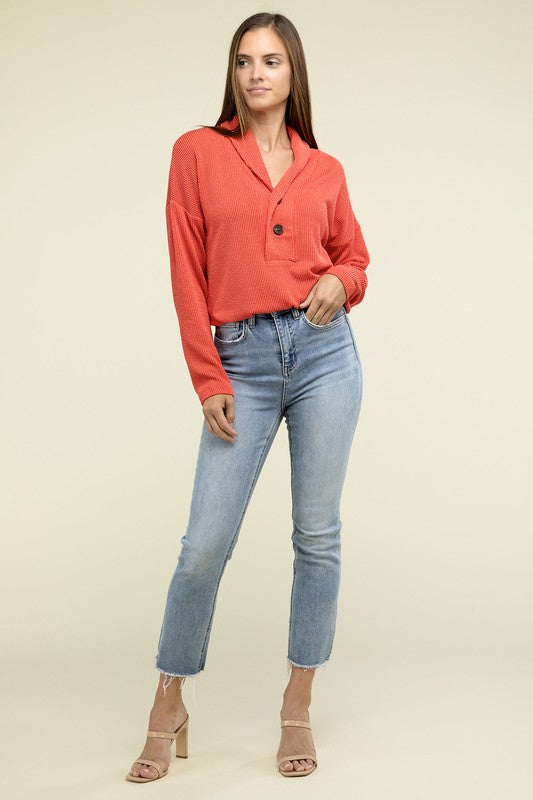 Tomato textured pullover top with V-neck, button closure, chest pocket, elastic waist
