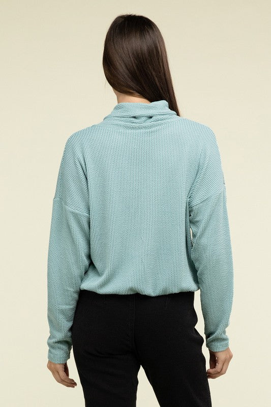 Teal textured pullover top back view with long sleeves and folded collar