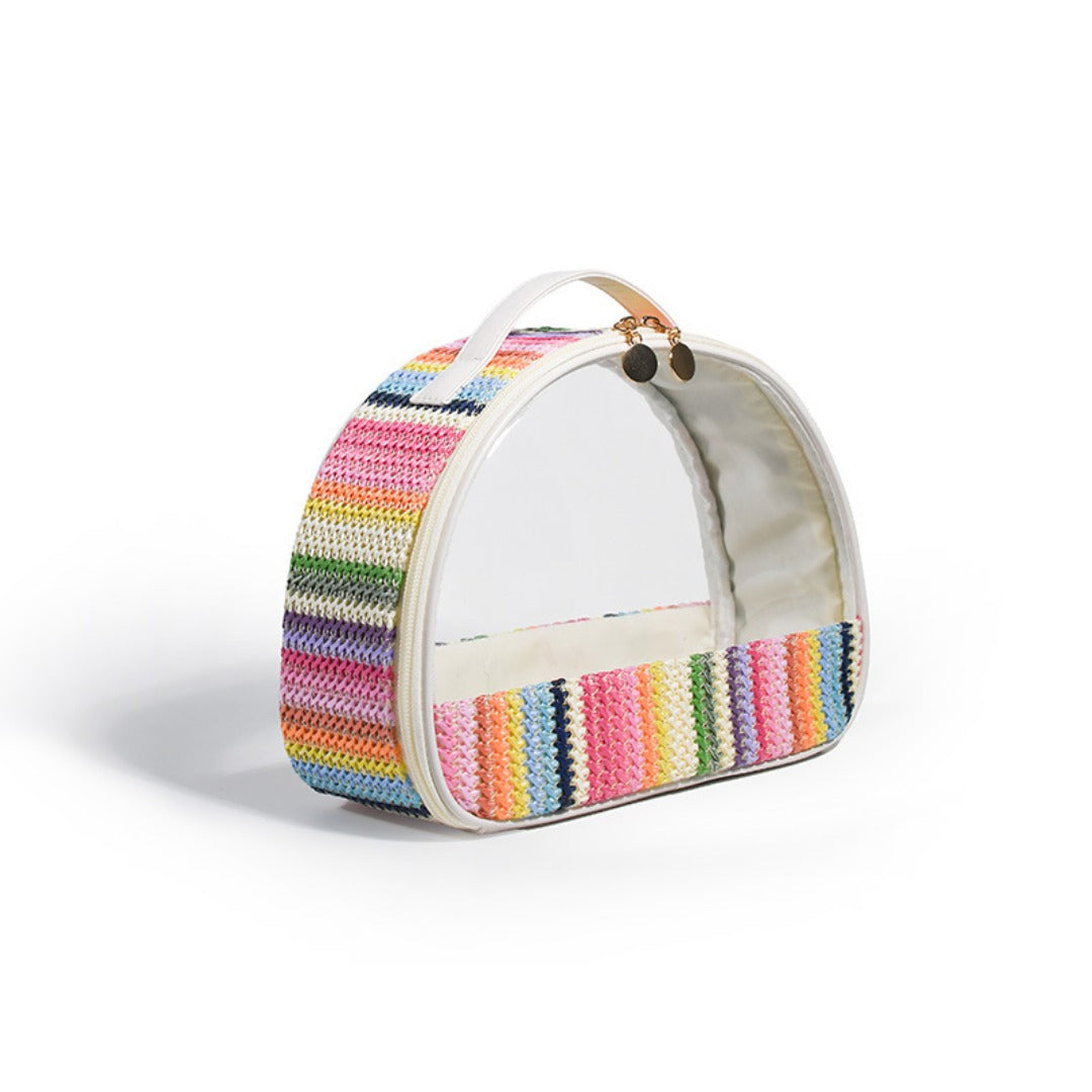 Rainbow striped semicircular clear wash bag with arched top handle and visible lining