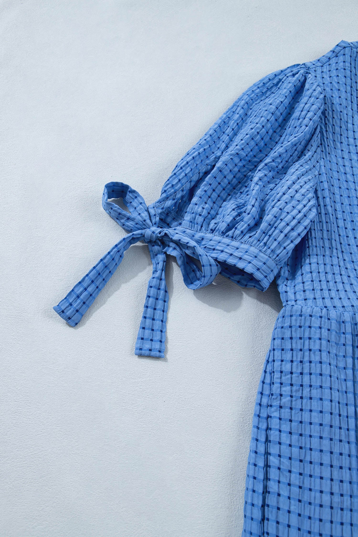 Dusk blue tiered midi dress with long tie sleeves and bow at neckline