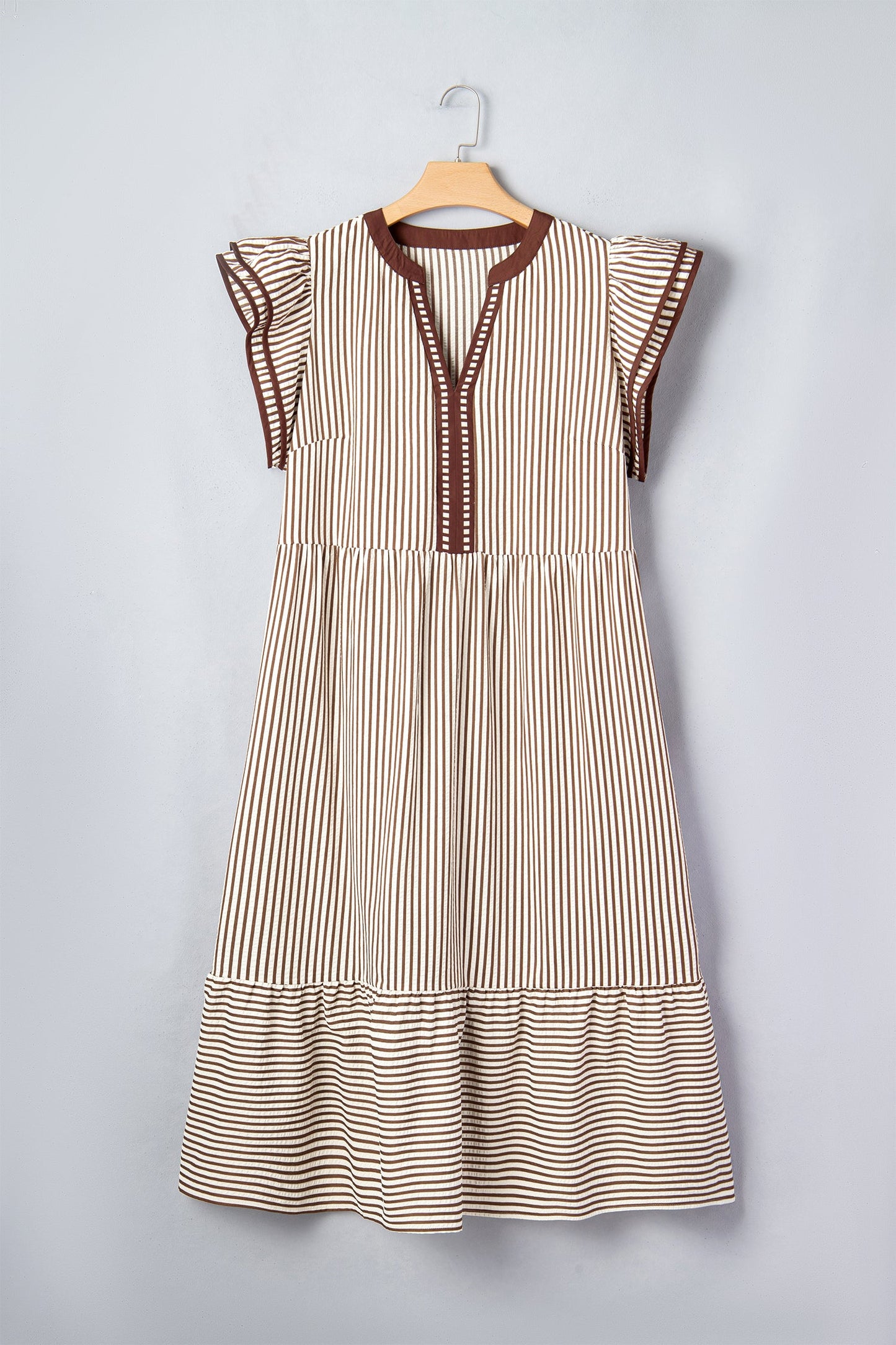 Striped sleeveless maxi dress on hanger with flutter shoulders and tiered hem