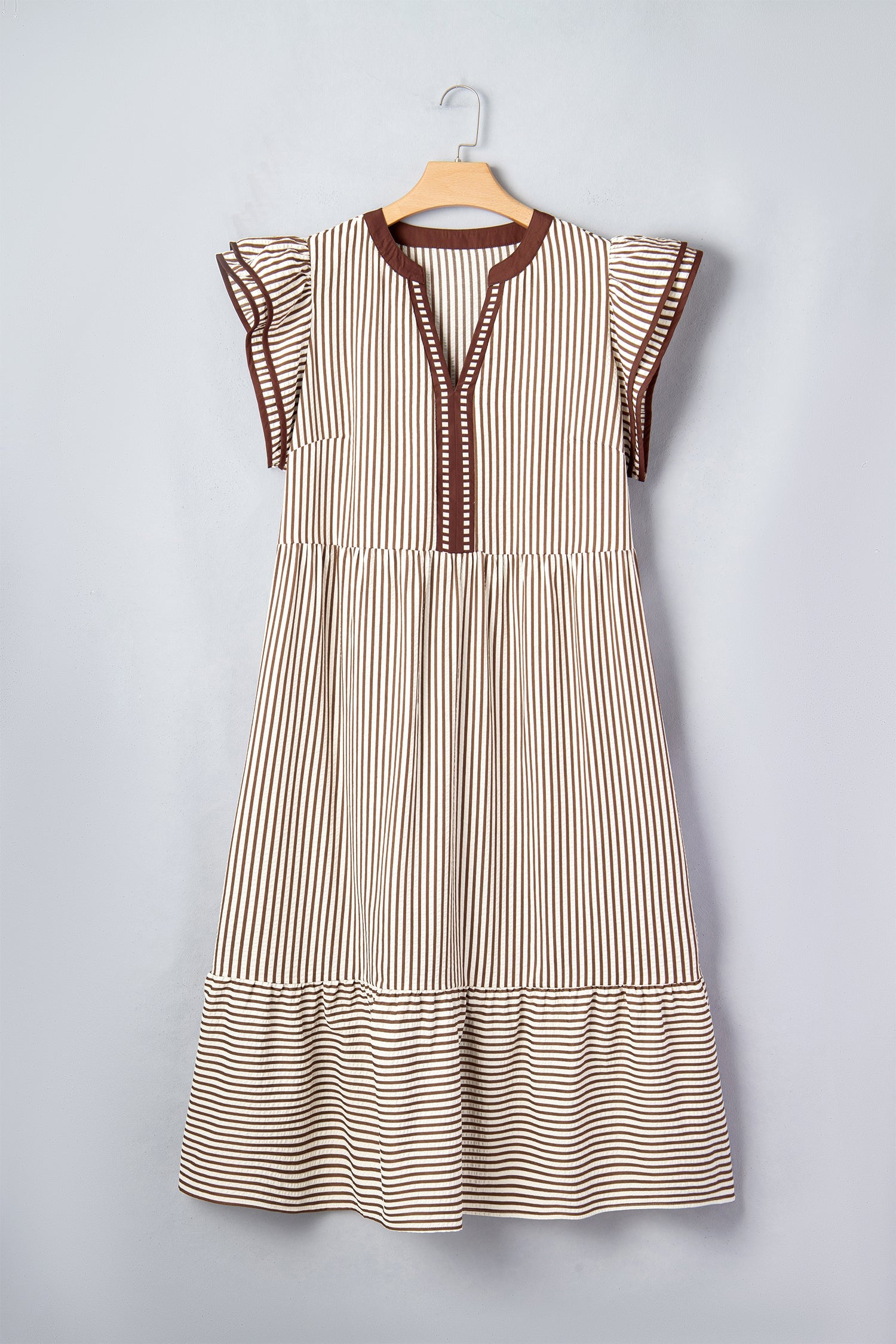 Striped sleeveless maxi dress on hanger with flutter shoulders and tiered hem