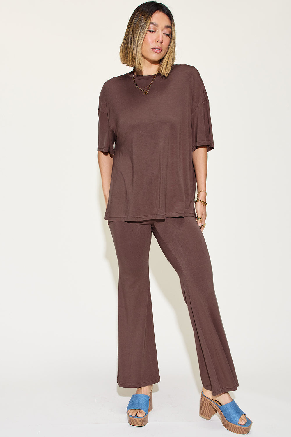 Chocolate brown drop-shoulder t-shirt and flare pants set, front view