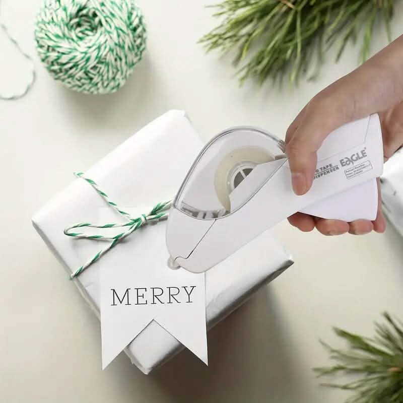 Hand using a tape dispenser on a wrapped gift with 'MERRY' banner