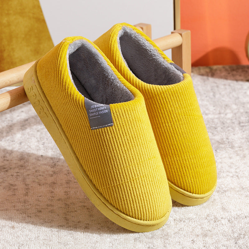 Women’s slip-on slippers, bright yellow with fuzzy gray lining and grippy sole