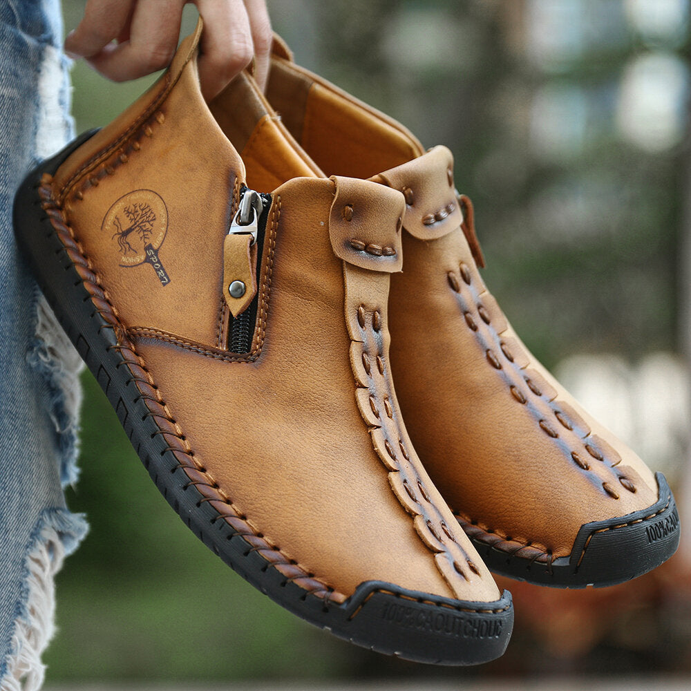 Tan men's ankle boots with side zipper, stitched leather upper, rubber tread sole