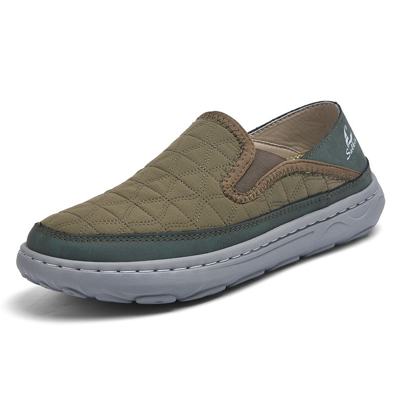 Men's casual travel slip-on shoes in olive-tan with teal trim, quilted upper and sole
