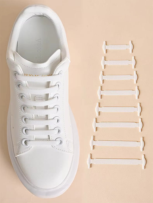 White elastic shoelace bands set beside a white sneaker with lace loops