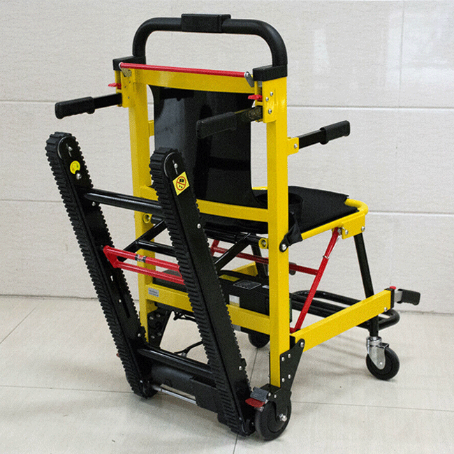 Front view of yellow electric stair-climbing wheelchair lift on rail tracks