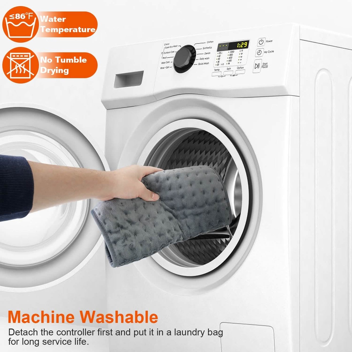 Grey electric heating pad with quilted surface, held over washing machine drum