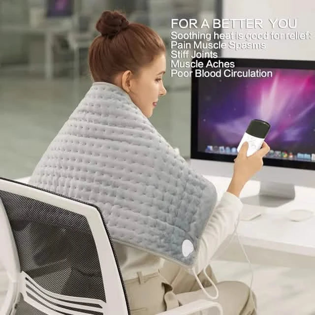Light gray heated neck and back pad with power cord plugged in while a person sits