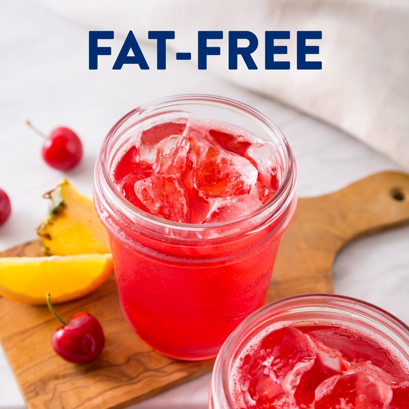 Fat-free mixed fruit nutrition drink with ice and fruit, fat-free text