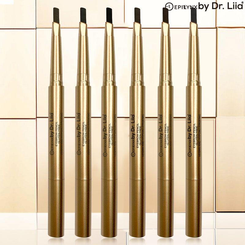 Line of gold eyebrow pencils with black tips, multiple shades.