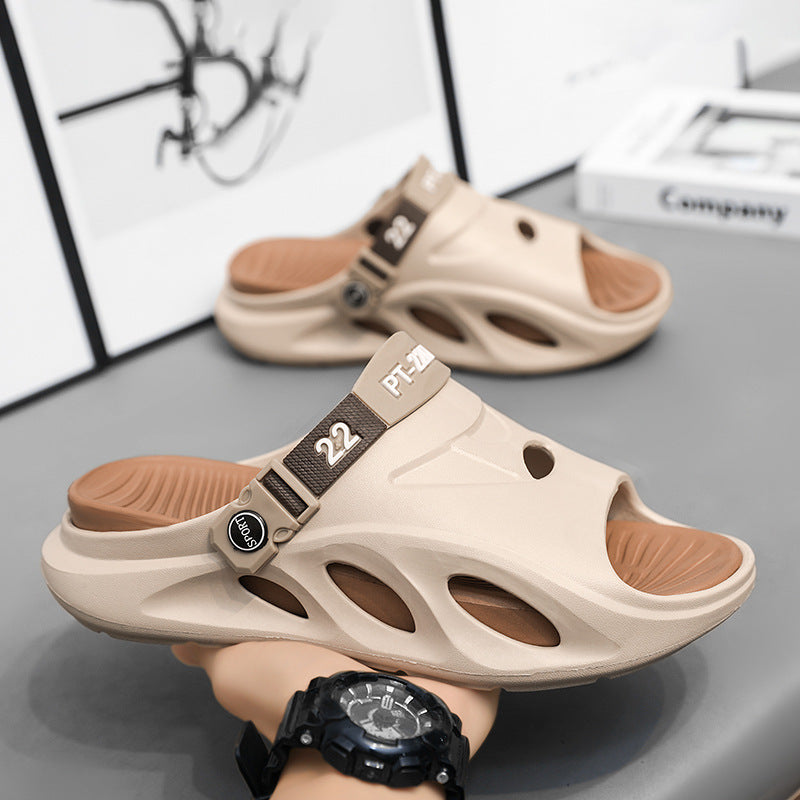 Beige slide sandals with dark adjustable strap and openwork cutouts on upper