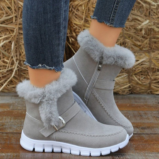 Grey ankle snow boots with faux fur cuff, side buckle strap, chunky white sole