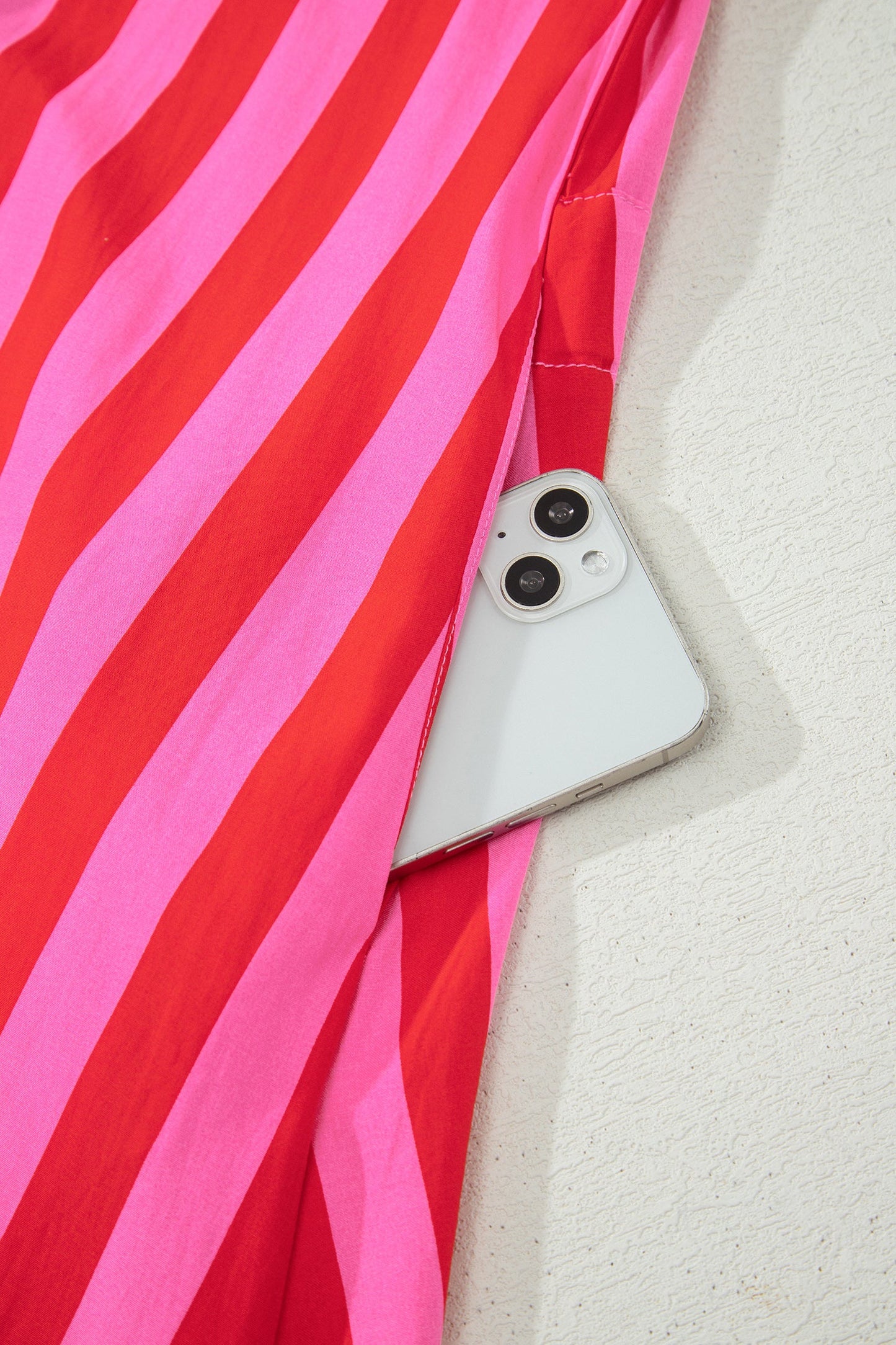 Pink and red striped long-sleeve mini dress with button placket detail